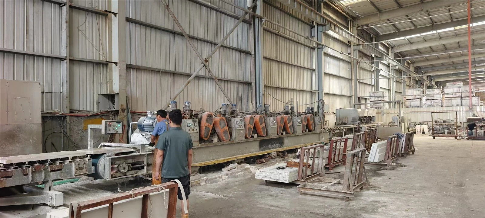 Automated multi-head stone edge-processing line used with custom diamond wheels to form long marble fluted tiles. Automated multi-head stone edge-processing line used with custom diamond wheels to form long marble fluted tiles.